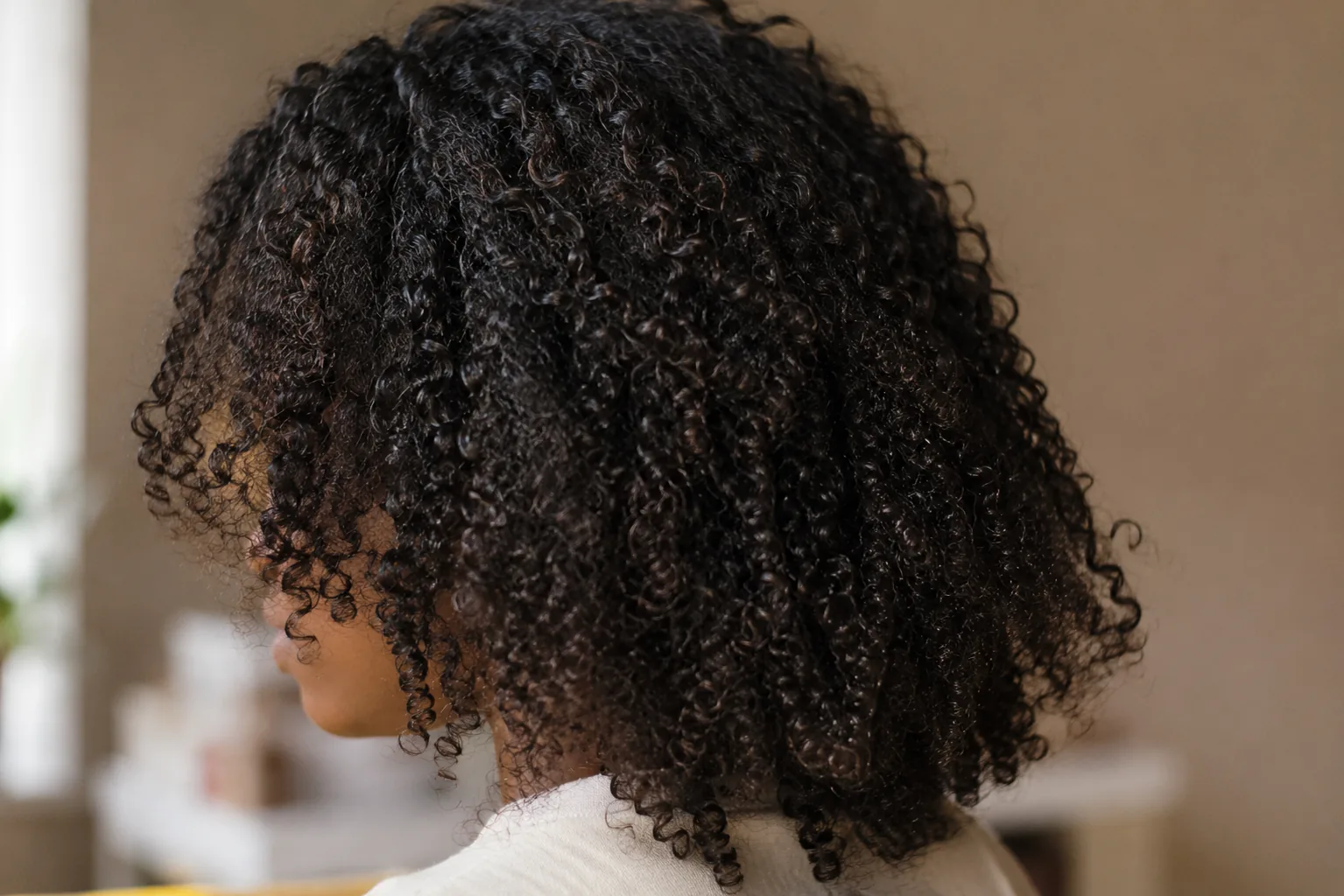 A range of hair textures, from wavy to coily